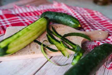 Top and side view of cut cucumber on cutting board