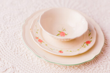 Closeup of porcelain plates and bowls