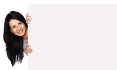 Close-up of a young woman holding signboard