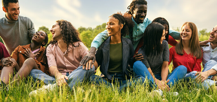 Multicultural Group of Friends Enjoying Outdoor Activities in a Park