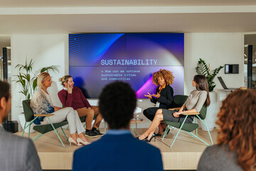 Renewable energy discussion panel in business conference.