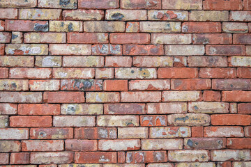 Obraz premium rough red stone brick wall texture background, abstract background
