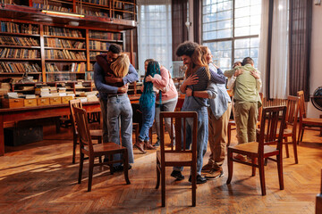 People hugging in mental health therapy.