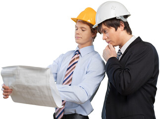 Young architect and supervisor reviewing blueprints