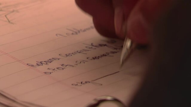 Hands of a Female Primary Student Writing during a Class in Catamarca Province, Argentina. Close Up.  