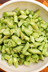 Top-View of Chopped Cooked Green Beans in Ceramic Bowl