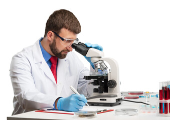 Young scientist man looking through a microscope in a laboratory.