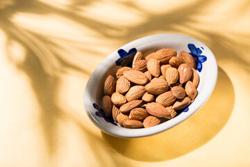 pile of natural almonds (Prunus dulcis) close-up image