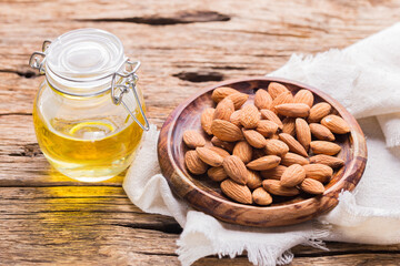 Almond oil and seeds (Prunus dulcis) close-up image