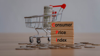 Letter block in word CPI abbreviation of consumer price index on wood background.