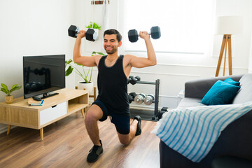 Fitness latin man lifting weights during his home workout