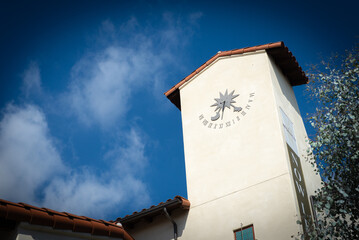 Sun dial clock on side of spanish building