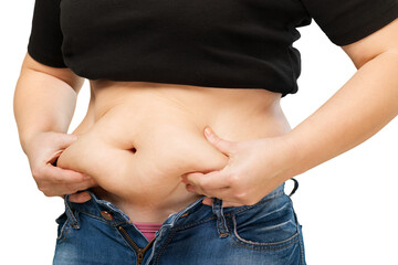 Woman's hand holding excessive belly fat