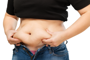 Woman's hand holding excessive belly fat