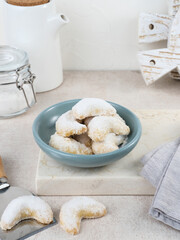 Kue Putri Salju or Snow White Cookies with crescent shaped. Made from flour, sugar and butter coated with powdered sugar. 
