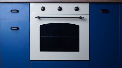 New stylish closed oven in kitchen. Cooking appliance