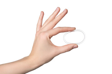 Woman holding diaphragm vaginal contraceptive ring on white background, closeup