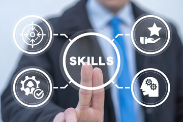 Businessman using virtual touch screen presses word: SKILLS. New Skills Knowledge Webinar Training...
