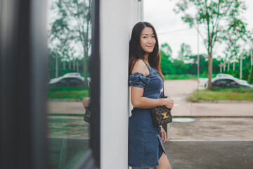 Portrait young asian beautiful stylish of a smiling woman outdoor