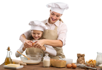 The beautiful young mother and her little daughter cook at home