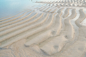 Fototapeta na wymiar sand forms elongated formations on the beach
