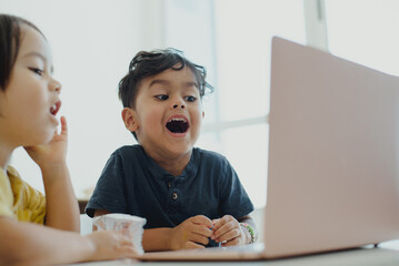 Children learning in their online classes