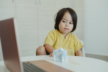 Child learning in his online classes