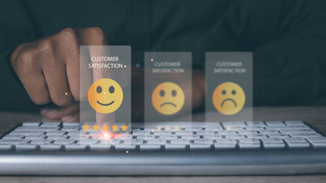 Man using computer giving high score with five star icon and happy smiley face. Customer satisfaction experience.