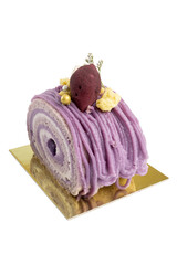 Fresh Baked Purple Sweet Potato Cake Roll, sweet dessert made from sponge cake filled with sweet potato cream in layers.
