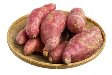 Collection of whole raw Japanese sweet potatoes on wicker basket.