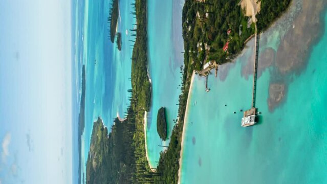 Timelapse over tropical Kuto Bay, Ise of Pines. Vertical aerial parallax.