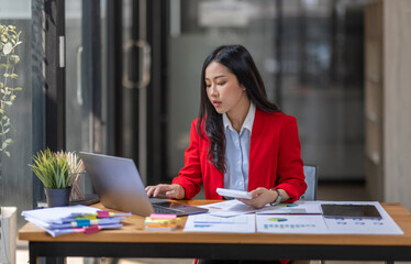 Businesswoman working at office with documents on desk, doing planning analyzing the financial report, Asian woman business plan investment, finance analysis concept