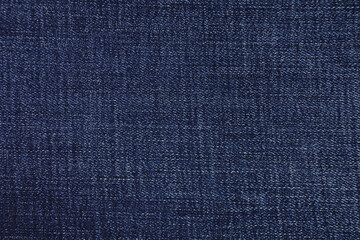Fototapeta na wymiar Blue jeans fabric background texture. Blue jeans fabric cloth textile material.