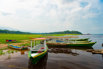 boat at riverside nature. wooden boat at riverside. landscape with boat at riverside.