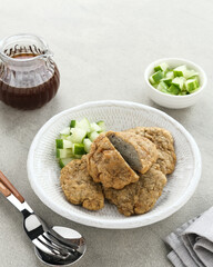 Pempek Kulit, traditional food from South Sumatra, Indonesia. This fish-based food is very popular. Served with cuko sauce and cucumber slices.
