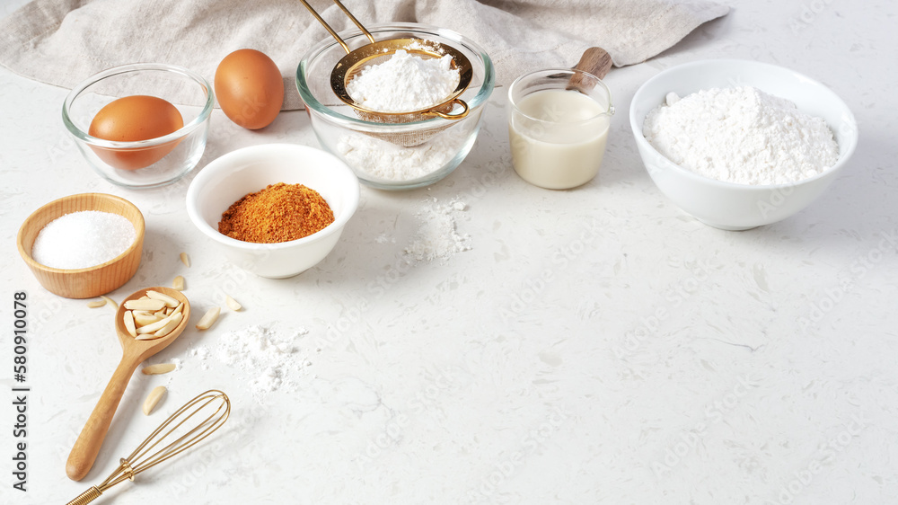 Wall mural baking and cooking background, brown sugar, butter, flour, eggs and milk with utensil on marble tabl