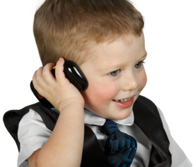 Portrait of cute little boy in suit using mobile isolated on white background