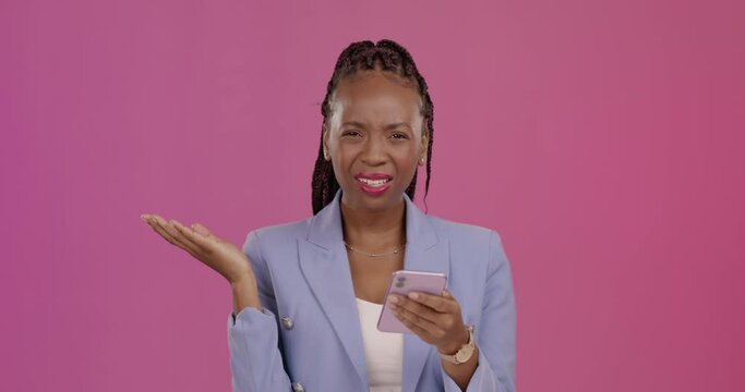 Confused, text message and phone with black woman in studio for annoyed, social media or news. Online scam, spam and frustrated with female on purple background for notification, angry or connection