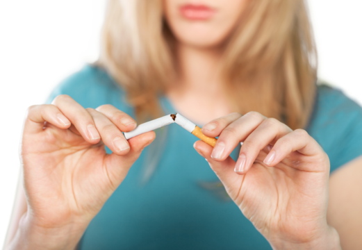 A woman breaking a cigarette, Stop smoking concept