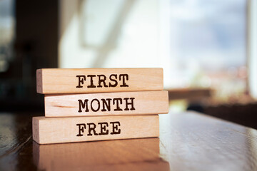 Wooden blocks with words 'First month free'.