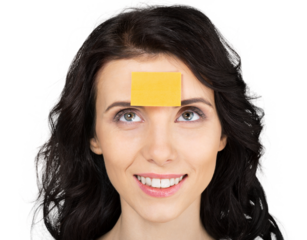 Young cute woman with yellow sticker on head isolated on white background