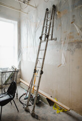 Repair in a room with a ladder against the wall