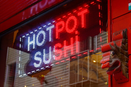 Neon signboard with inscription on window
