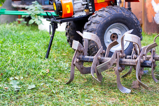 cutters complete with walk-behind tractor for work on the ground. Technique for agriculture. Motor cultivator. Copy space for text