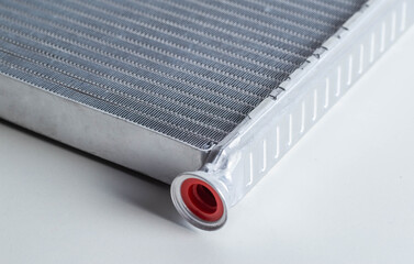 New car radiator car stove on a white background, close-up