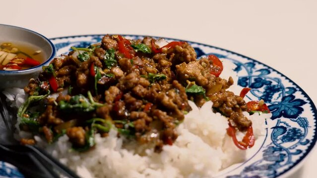 Stir fried Minced pork with basil,fast food Thai Style food. Thailand street food.
 Thailand's national dishes, Thai name is Pad kra prao Mou. famous food in Thailand