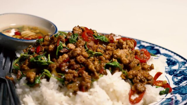 Stir fried Minced pork with basil,fast food Thai Style food. Thailand street food.
 Thailand's national dishes, Thai name is Pad kra prao Mou. famous food in Thailand