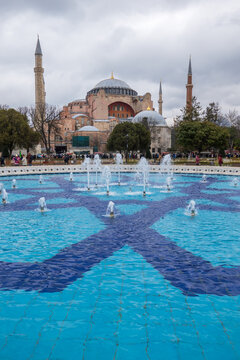 Fountain with blue tiled floor near ancient mosque