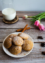 Freshly baked cookies with cinnamon, coffee. Sweet lunch. On a wooden background