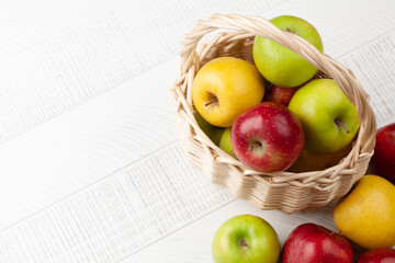Colorful ripe apple fruits in basket